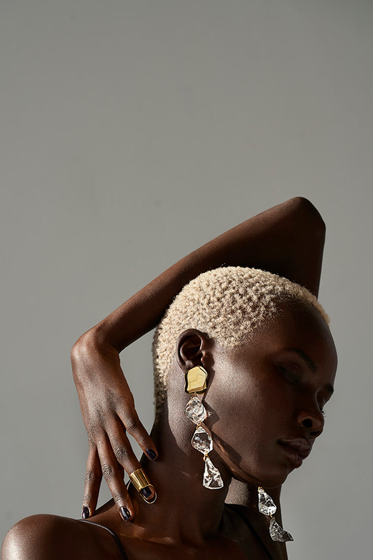 Sterling King Lucite Rock Candy Earrings in Gold paired with Gold Helmet Ring model shot