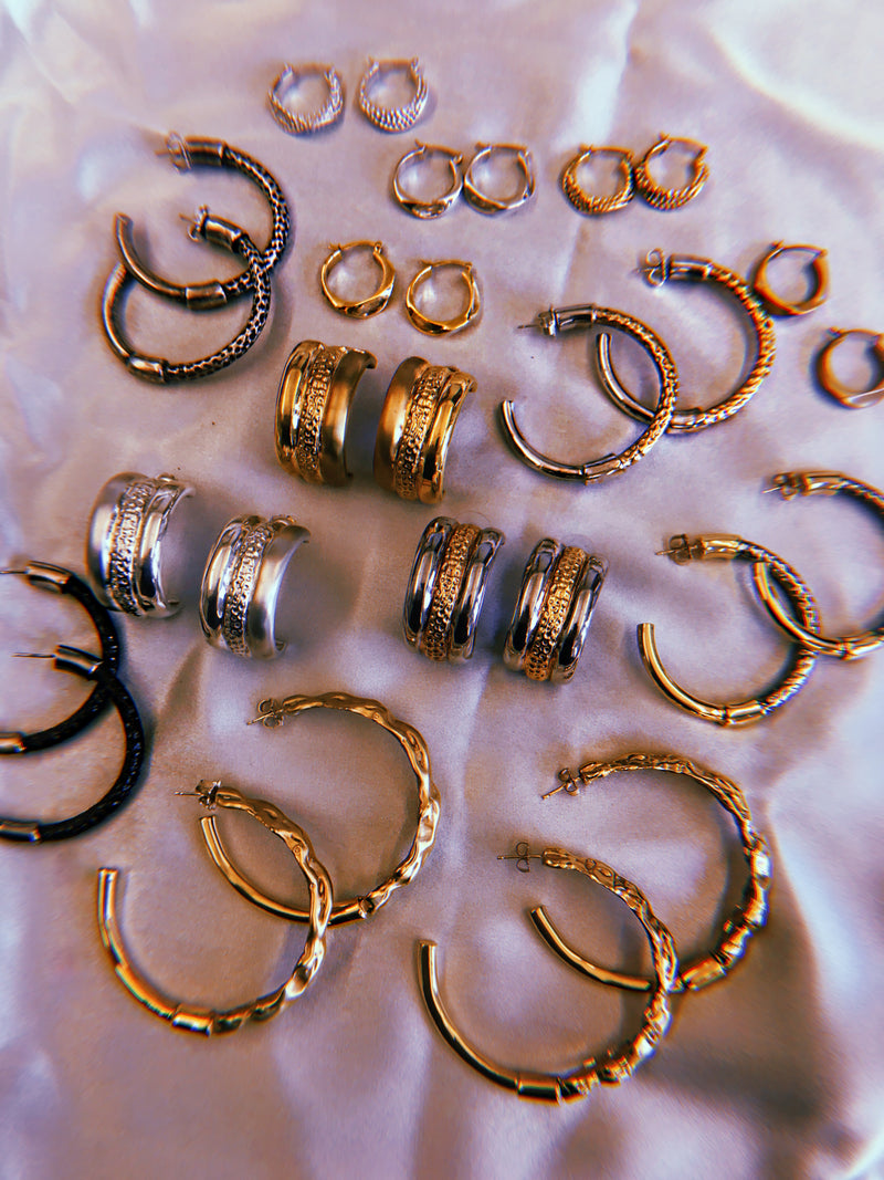 Sterling King Lithop Ridge Minis placed with Ridge Mini Earrings, Molten Hoops, Trinity Hoops and Lithop Hoops