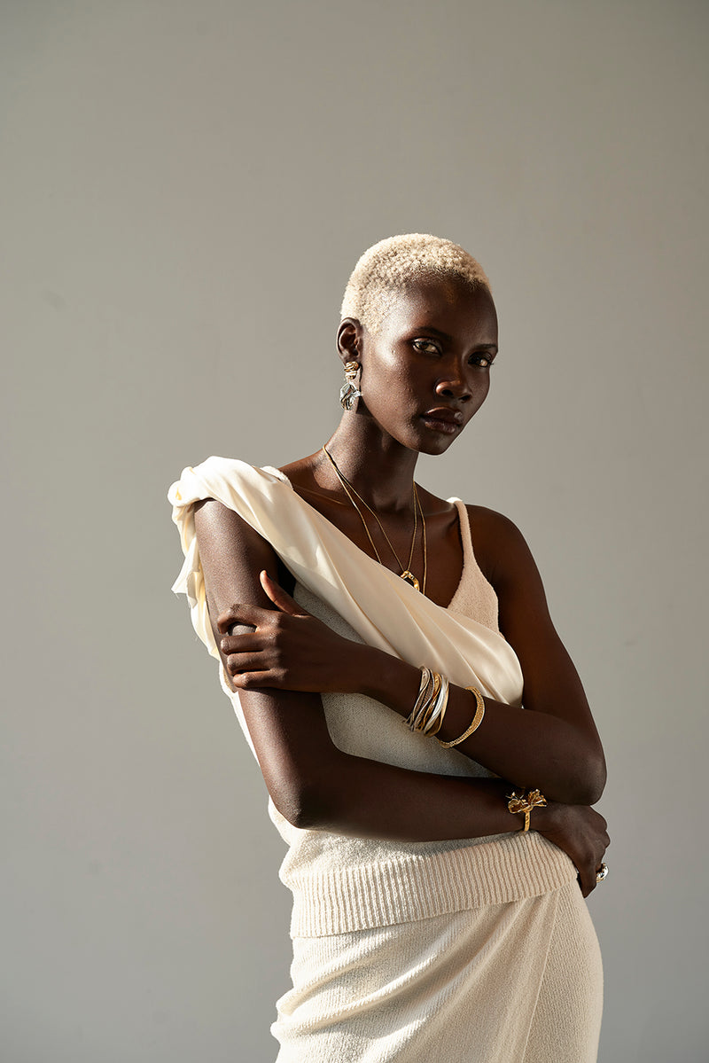 Tricia wearing Sterling King Lithop Ridge Bracelets in Silver and Gold paired with Molten Pendant and the Fold Mini Earrings