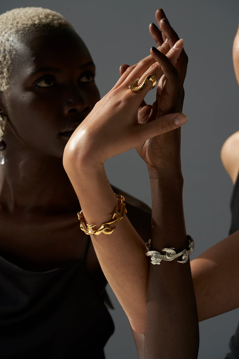 Sterling King Serpentine Wave Ring in Textured Gold paired with Serpentine Infinity Bracelets