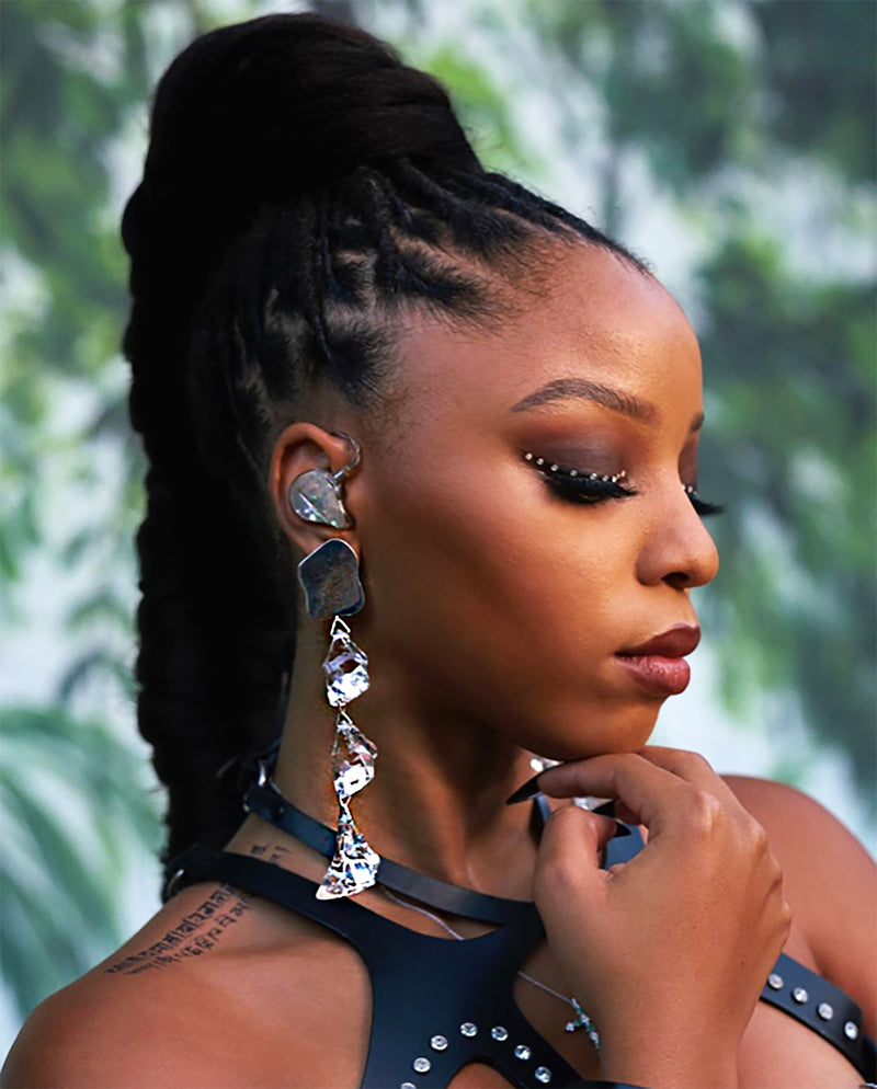 Chloe Bailey wearing Sterling King Dangling Lucite Rock Candy Earrings in Sterling Silver for Chloe x Halle's video performance of "Forgive Me," August 2020