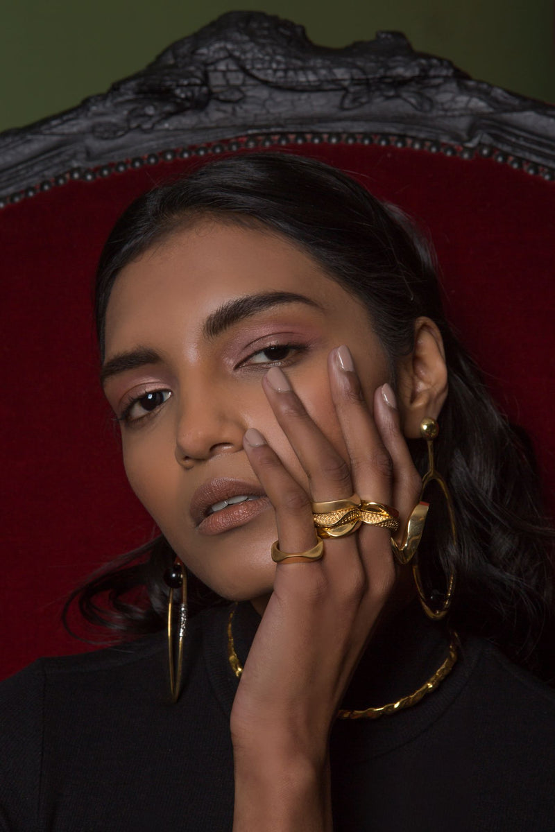 Sterling King Magma, Lithop and Satin Ridge Rings in Gold paired with Molten Choker and Pearl Ellipse Earrings