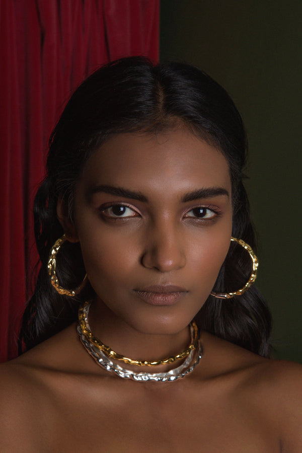 Sterling King Molten Hoops in Mirror Gold paired with Molten Chokers in Gold and Silver 