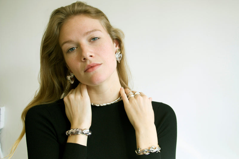 Sterling King Molten Cuff paired with Serpentine Infinity Bracelet, Ridge Rings, Molten Choker and Delphinium Earrings