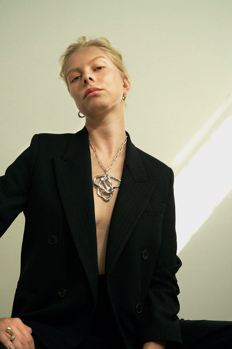 Sterling King Lithop Ridge Hoop Minis in Gold paired with Molten Ribbon Pendant in Silver