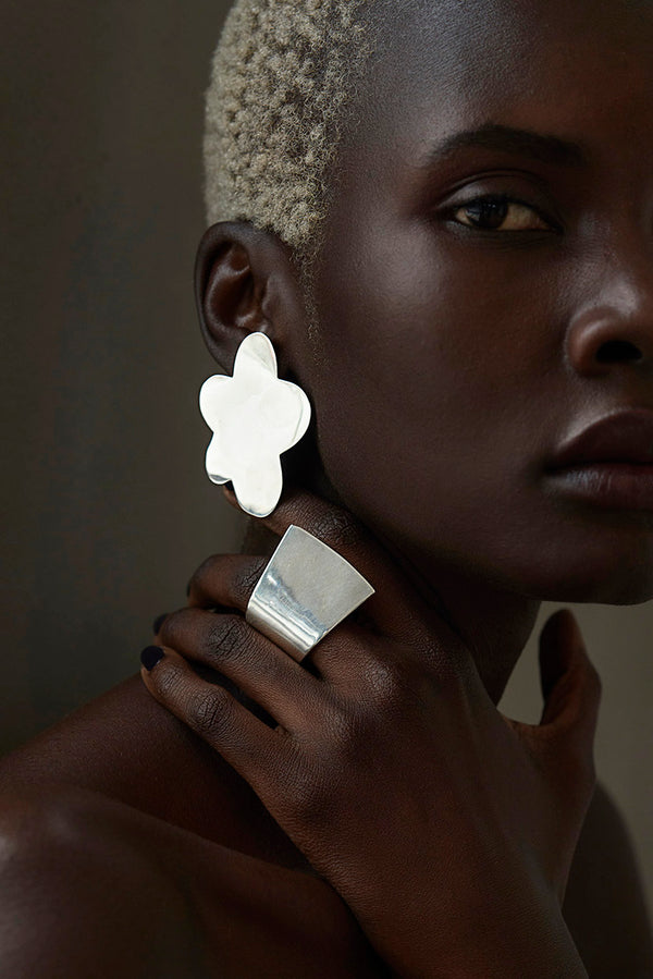 Tricia wearing Sterling King Flora Earrings in Sterling Silver and the Overlap Ring in Sterling Silver